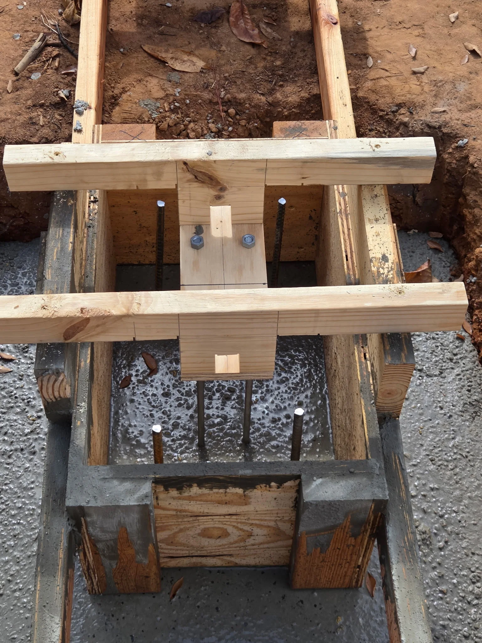 Anchor bolts positioned in a concrete foundation